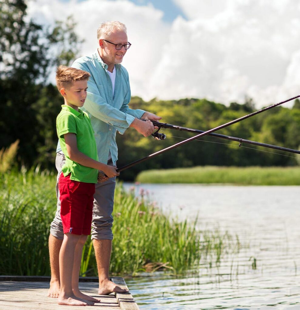 grandfather and grandson standing on dock fishing long term care insurance houston tx